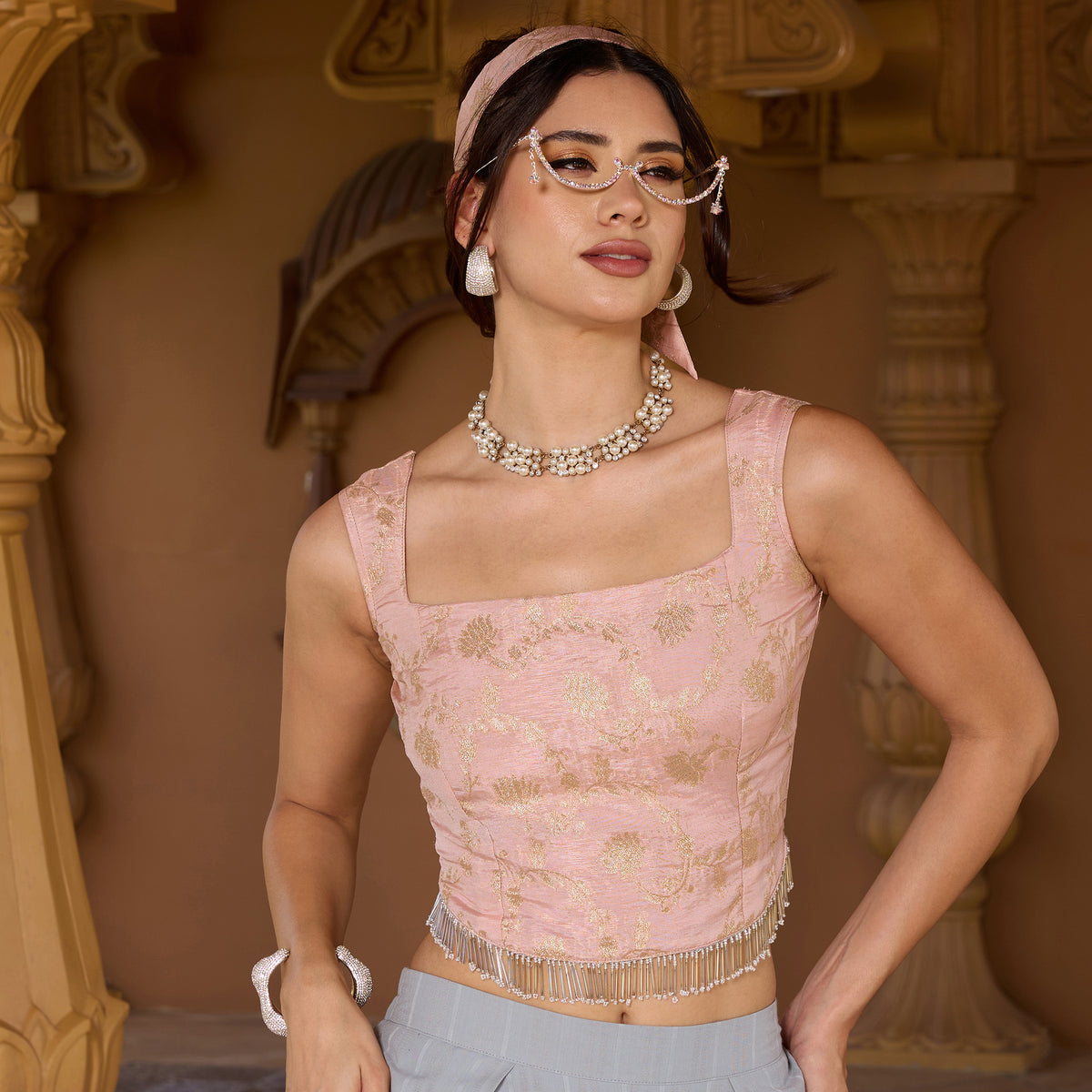 Sleeveless brocade top with trousers