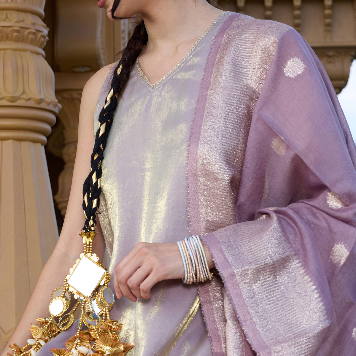Sleeveless kurta with trousers and brocade dupatta