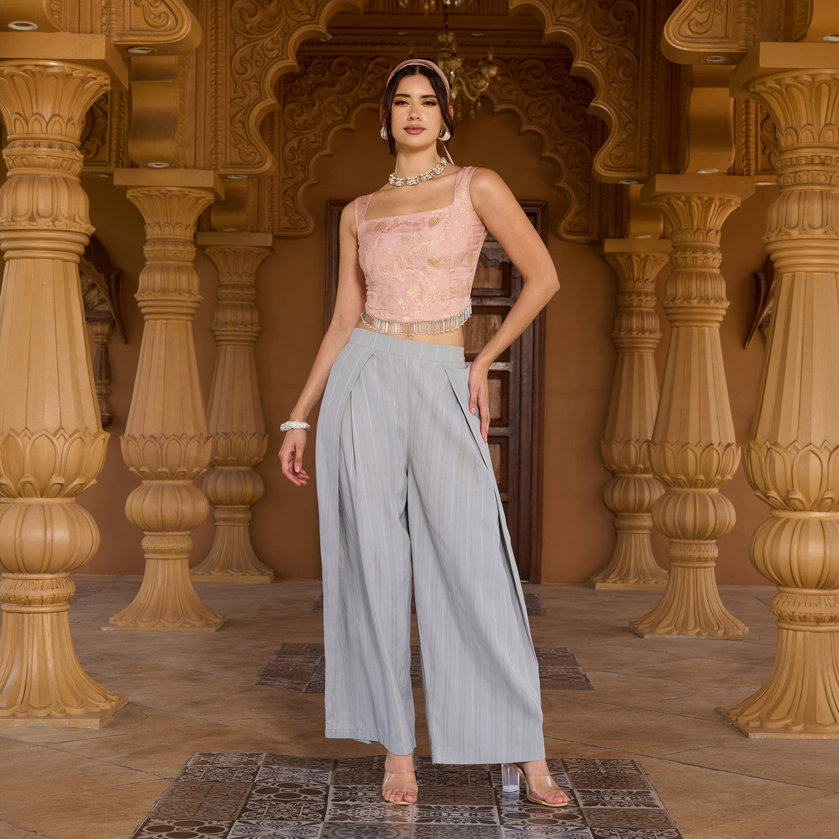Sleeveless brocade top with trousers