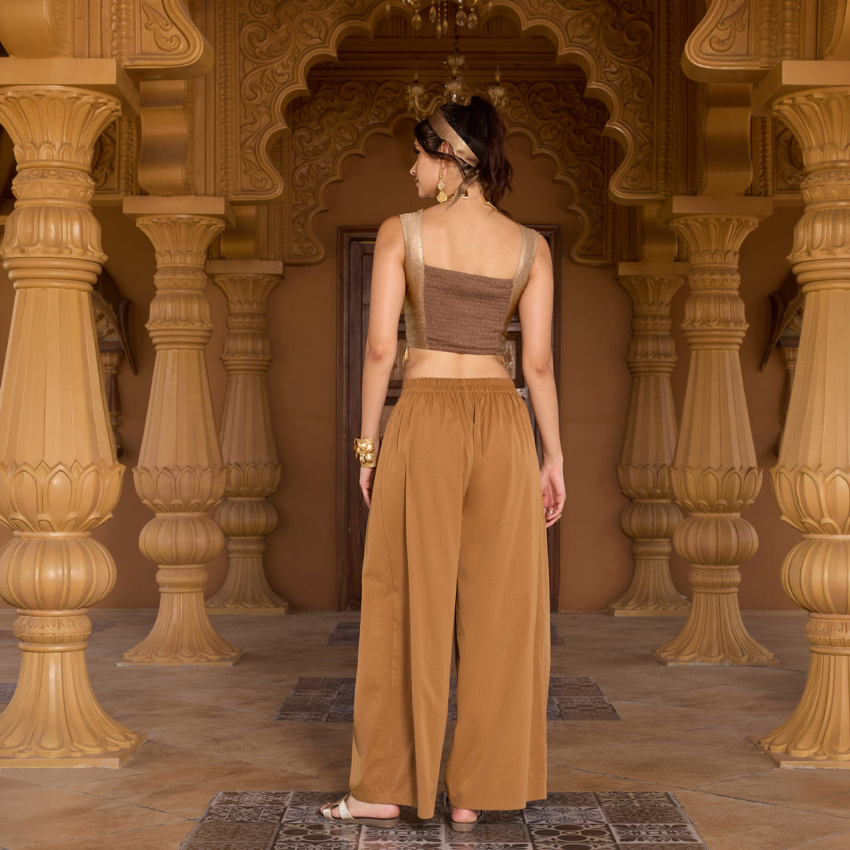 Sleeveless brocade top with trousers