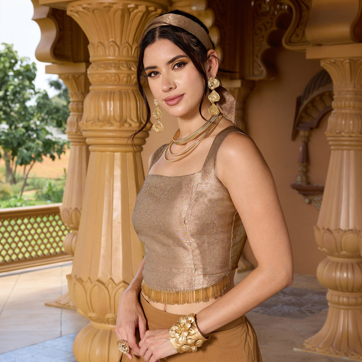 Sleeveless brocade top with trousers